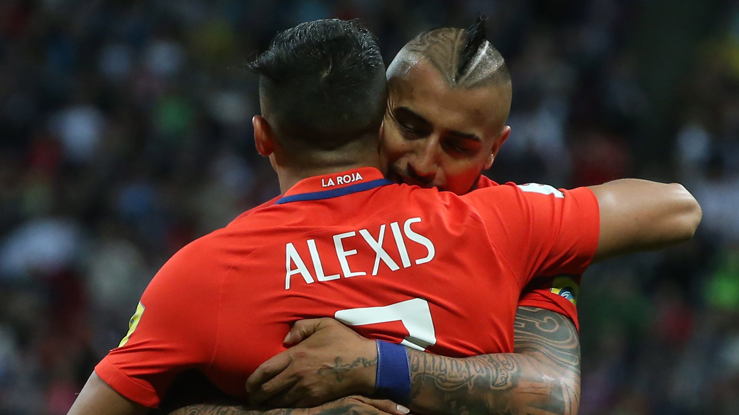 KAZAN, RUSSIA - JUNE 22, 2017: Chile's Alexis Sanchez (front) and Arturo Vidal embrace in the 2017 FIFA Confederations Cup Group B football match against Germany at Kazan Arena Stadium. The game ended in a 1-1 draw. Stanislav Krasilnikov/TASS (Photo by Stanislav KrasilnikovTASS via Getty Images)