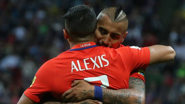 KAZAN, RUSSIA - JUNE 22, 2017: Chile's Alexis Sanchez (front) and Arturo Vidal embrace in the 2017 FIFA Confederations Cup Group B football match against Germany at Kazan Arena Stadium. The game ended in a 1-1 draw. Stanislav Krasilnikov/TASS (Photo by Stanislav KrasilnikovTASS via Getty Images)