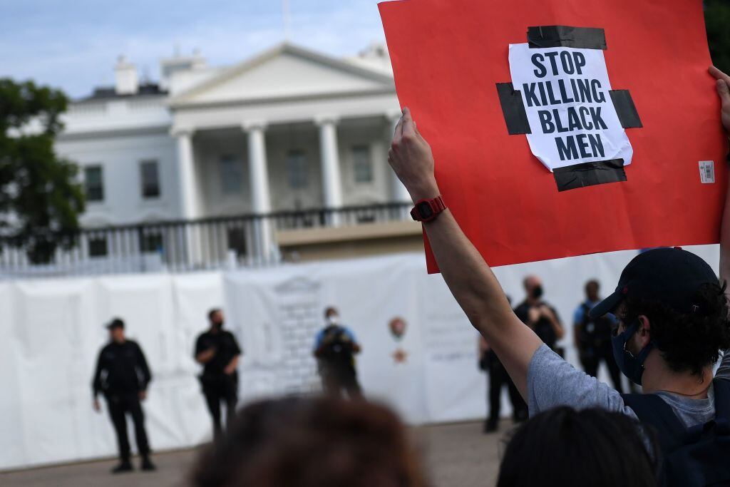 Protesters gather outside the White House in Washington, DC, on May 29, 2020 in a demonstration over the death of George Floyd, a black man who died after a white policeman kneeled on his neck for several minutes. - Demonstrations are being held across the US after George Floyd died in police custody on May 25. (Photo by Eric BARADAT / AFP) (Photo by ERIC BARADAT/AFP via Getty Images)