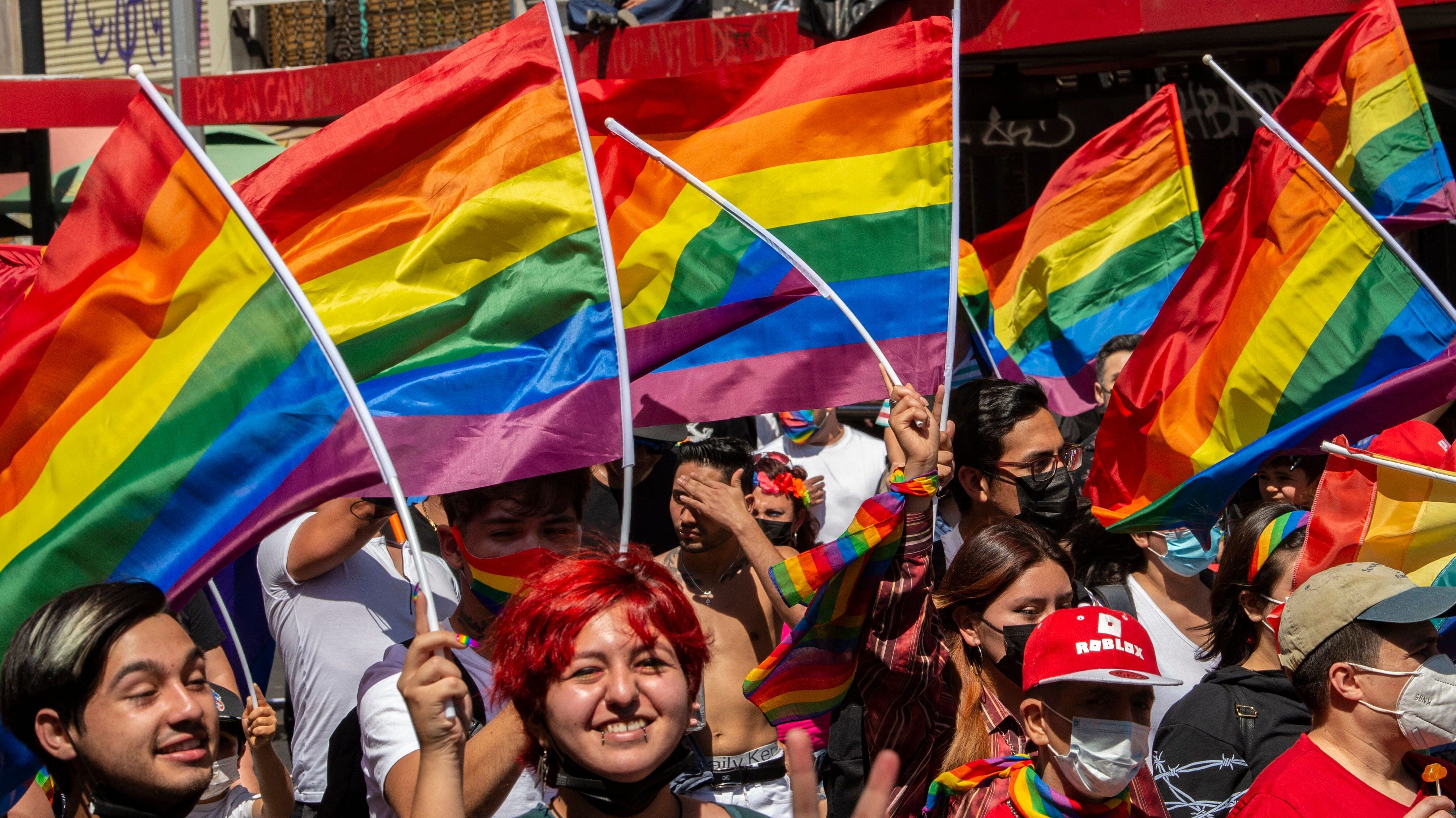 Revelers take part in the Pride Parade in Santiago, on November 13, 2021. (Photo by MARTIN BERNETTI / AFP) (Photo by MARTIN BERNETTI/AFP via Getty Images)