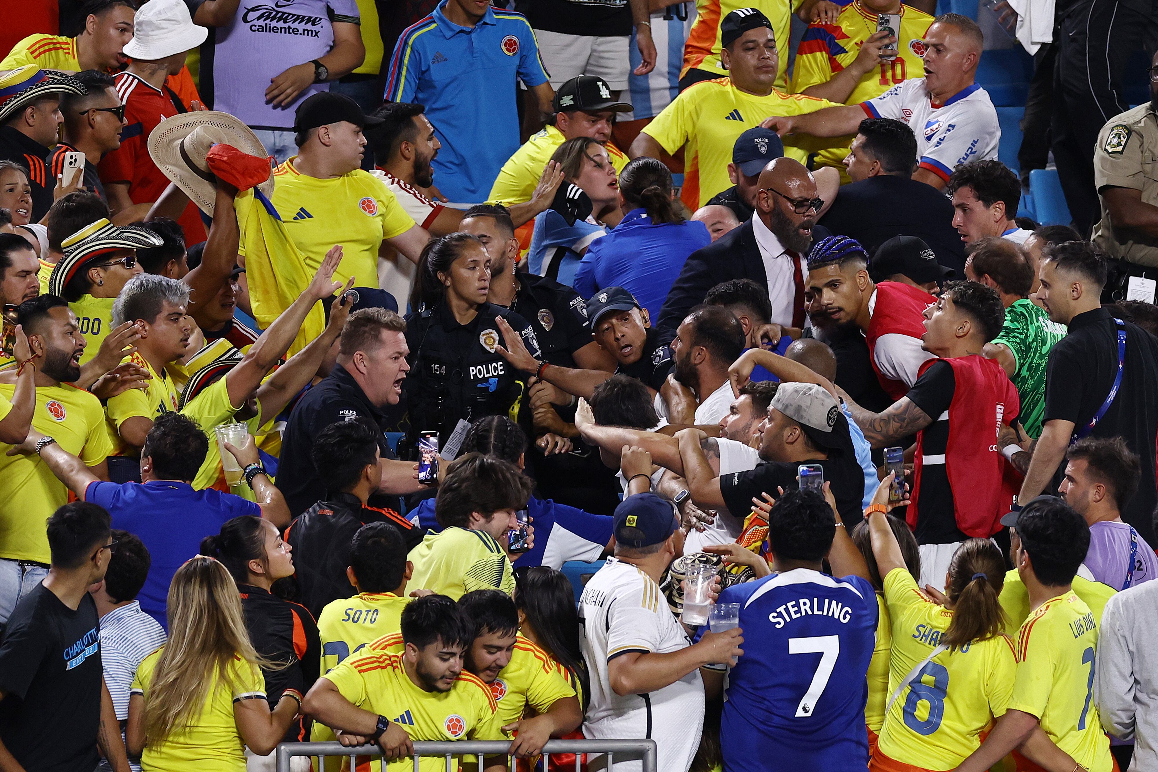 CHARLOTTE, NORTH CAROLINA - JULY 10: Fans of Colombia fights with fans of Uruguay during the CONMEBOL Copa America 2024 semifinal match between Uruguay and Colombia at Bank of America Stadium on July 10, 2024 in Charlotte, North Carolina. (Photo by Tim Nwachukwu/Getty Images)
