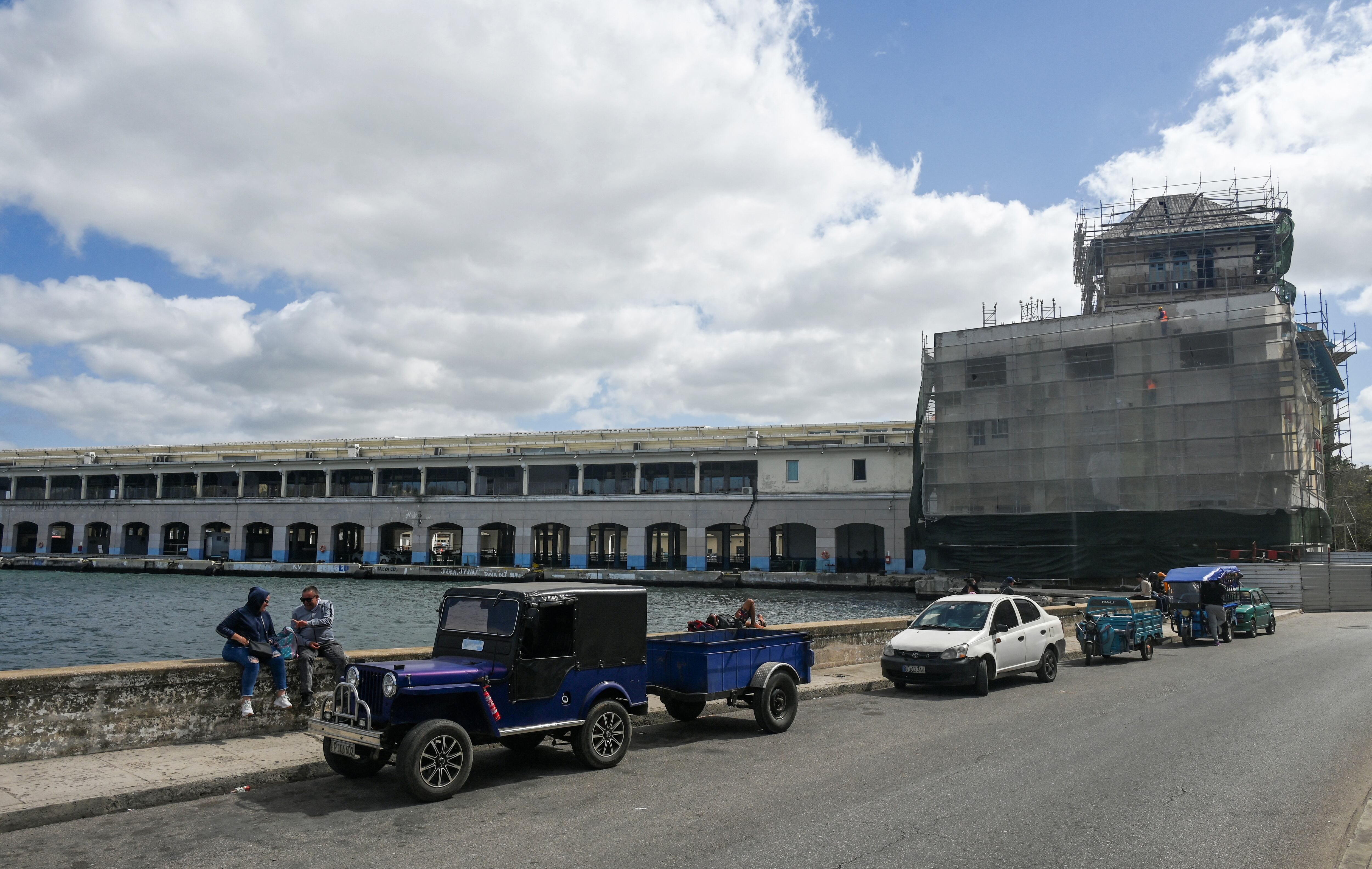 People are seen outside the Havana Cruise Terminal. (Photo by YAMIL LAGE / AFP via Getty Images)