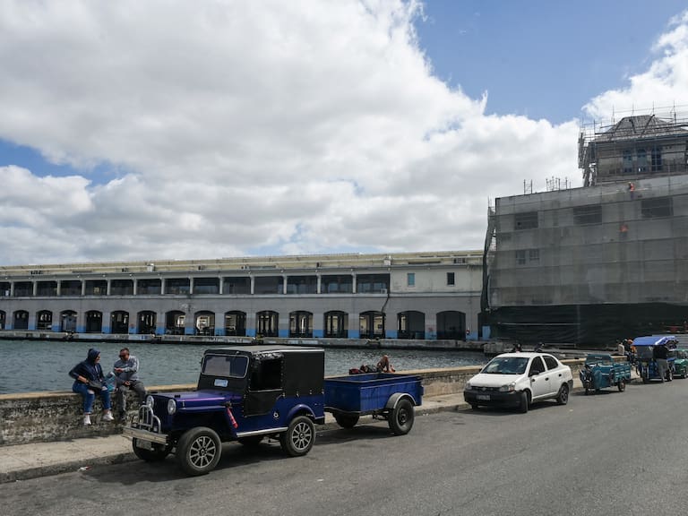 People are seen outside the Havana Cruise Terminal. (Photo by YAMIL LAGE / AFP via Getty Images)