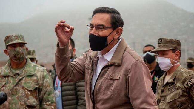 Peru's President Martin Vizcarra speaks to media before an operation to distribute essential products among those in need amid the COVID-19 novel coronavirus pandemic, in Villa Maria del Triunfo, on the southern outskirts of Lima, on September 15, 2020. - Vizcarra pushed back against his opponents on Monday days ahead of an impeachment vote, accusing Congress chief Manuel Merino of "conspiracy" by trying to secure military assurances for a bid to succeed him.Congress voted late Friday to open impeachment proceedings against Vizcarra for "moral incapacity" over accusations he incited aides to lie to anti-graft investigators. (Photo by Ernesto BENAVIDES / AFP) (Photo by ERNESTO BENAVIDES/AFP via Getty Images)