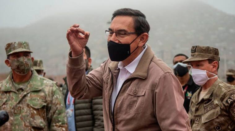 Peru's President Martin Vizcarra speaks to media before an operation to distribute essential products among those in need amid the COVID-19 novel coronavirus pandemic, in Villa Maria del Triunfo, on the southern outskirts of Lima, on September 15, 2020. - Vizcarra pushed back against his opponents on Monday days ahead of an impeachment vote, accusing Congress chief Manuel Merino of "conspiracy" by trying to secure military assurances for a bid to succeed him.Congress voted late Friday to open impeachment proceedings against Vizcarra for "moral incapacity" over accusations he incited aides to lie to anti-graft investigators. (Photo by Ernesto BENAVIDES / AFP) (Photo by ERNESTO BENAVIDES/AFP via Getty Images)