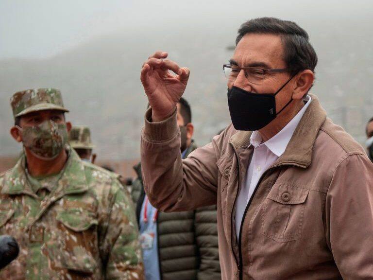 Peru's President Martin Vizcarra speaks to media before an operation to distribute essential products among those in need amid the COVID-19 novel coronavirus pandemic, in Villa Maria del Triunfo, on the southern outskirts of Lima, on September 15, 2020. - Vizcarra pushed back against his opponents on Monday days ahead of an impeachment vote, accusing Congress chief Manuel Merino of "conspiracy" by trying to secure military assurances for a bid to succeed him.Congress voted late Friday to open impeachment proceedings against Vizcarra for "moral incapacity" over accusations he incited aides to lie to anti-graft investigators. (Photo by Ernesto BENAVIDES / AFP) (Photo by ERNESTO BENAVIDES/AFP via Getty Images)