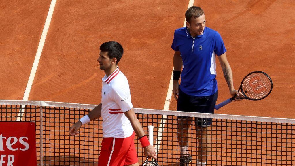 Serbia's Novak Djokovic (L) and Britain's Daniel Evans leave the court after their third round singles match on day six of the Monte-Carlo ATP Masters Series tournament in Monaco on April 15, 2021. (Photo by Valery HACHE / AFP) (Photo by VALERY HACHE/AFP via Getty Images)