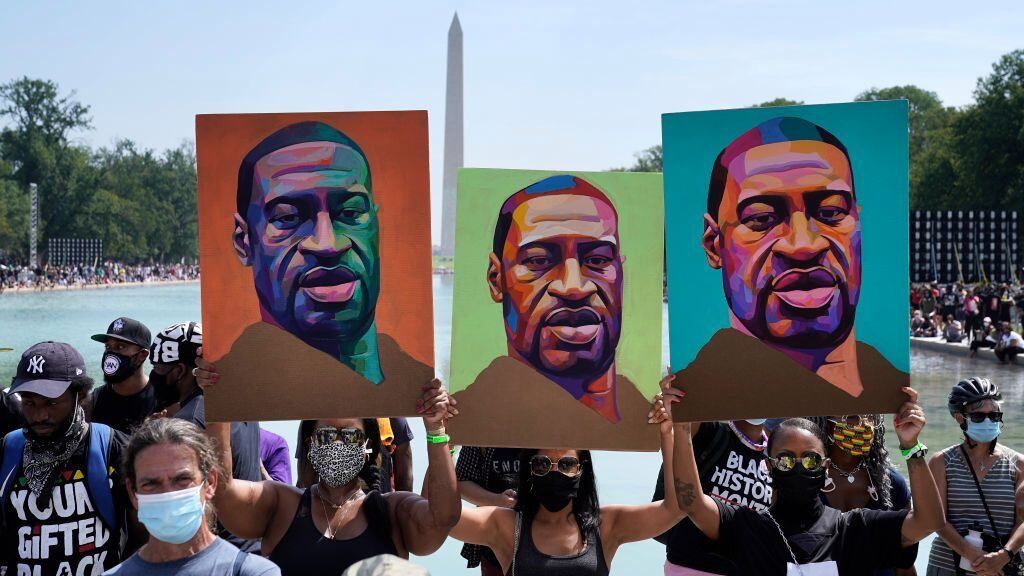 WASHINGTON, DC - AUGUST 28: Attendees hold images of George Floyd as they participate in the March on Washington at the Lincoln Memorial August 28, 2020 in Washington, DC. Today marks the 57th anniversary of Rev. Martin Luther King Jr.'s "I Have A Dream" speech at the same location. (Photo by Drew Angerer/Getty Images)