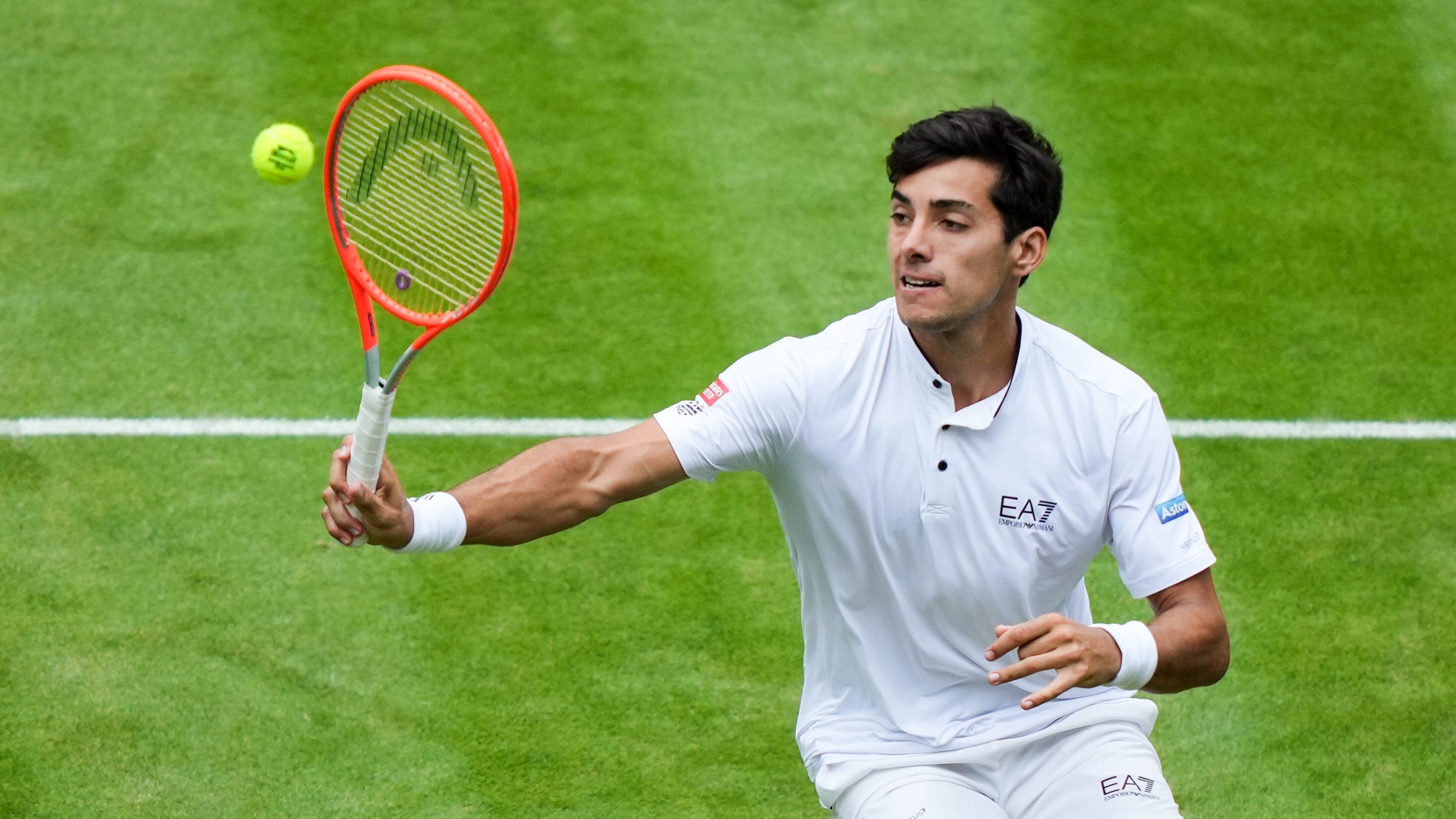 LONDON, ENGLAND - JULY 06: Cristian Garin of Chile plays a forehand in the Men's Singles Quarter Finals Match against Nick Kyrgios of Australia during day ten of The Championships Wimbledon 2022 at All England Lawn Tennis and Croquet Club on July 06, 2022 in London, England. (Photo by Shi Tang/Getty Images)