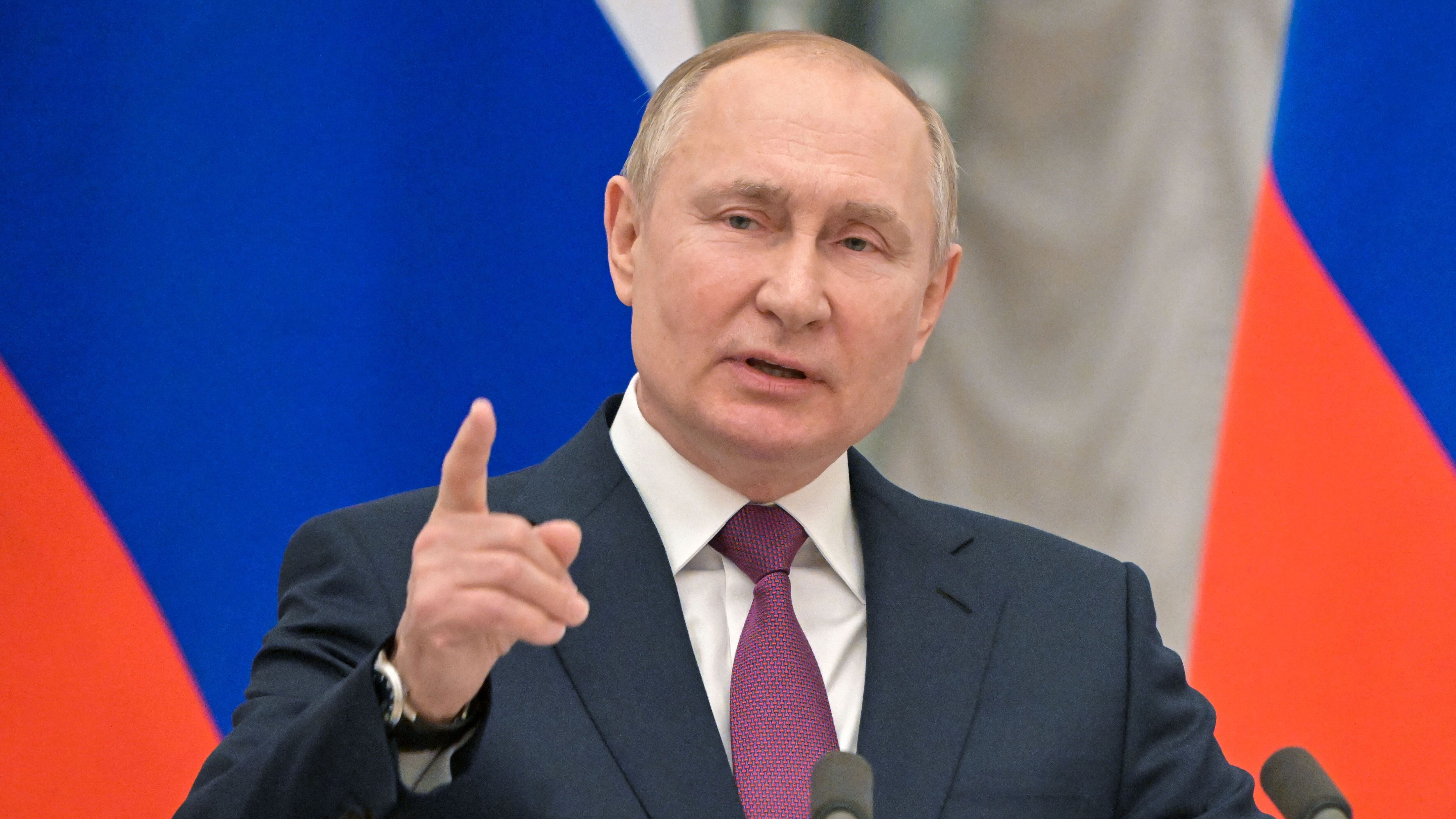 Russian President Vladimir Putin speaks during a joint press conference with German Chancellor following their meeting over Ukraine security at the Kremlin, in Moscow, on February 15, 2022. - The Kremlin, earlier on February 15, 2022, confirmed a pullback of some Russian forces from Ukraine's borders but said the move was planned and stressed Russia would continue to move troops across the country as it saw fit. (Photo by Mikhail Klimentyev / Sputnik / AFP) (Photo by MIKHAIL KLIMENTYEV/Sputnik/AFP via Getty Images)
