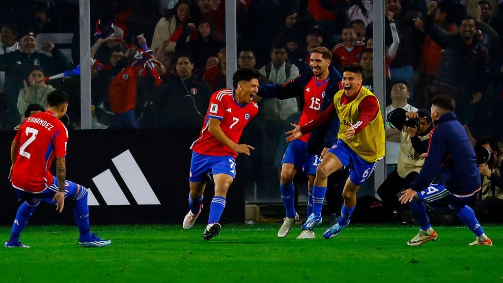 SANTIAGO, CHILE - OCTOBER 12: Marcelino Nuñez of Chile celebrates with teammates the team's second goal (own goal by Marcos Lopez of Peru) during the FIFA World Cup 2026 Qualifier match between Chile and Peru at Estadio Monumental David Arellano on October 12, 2023 in Santiago, Chile. (Photo by Marcelo Hernandez/Getty Images)