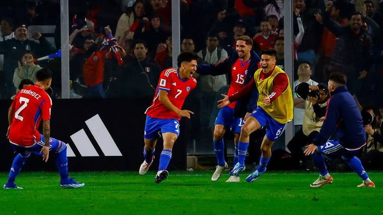 SANTIAGO, CHILE - OCTOBER 12: Marcelino Nuñez of Chile celebrates with teammates the team's second goal (own goal by Marcos Lopez of Peru) during the FIFA World Cup 2026 Qualifier match between Chile and Peru at Estadio Monumental David Arellano on October 12, 2023 in Santiago, Chile. (Photo by Marcelo Hernandez/Getty Images)