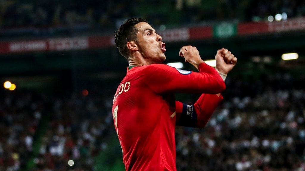 Portugal's forward Cristiano Ronaldo celebrates after scoring a goal during the Euro 2020 qualifier group B football match between Portugal and Luxembourg at the Jose Alvalade stadium in Lisbon on October 11, 2019. (Photo by CARLOS COSTA / AFP) (Photo by CARLOS COSTA/AFP via Getty Images)