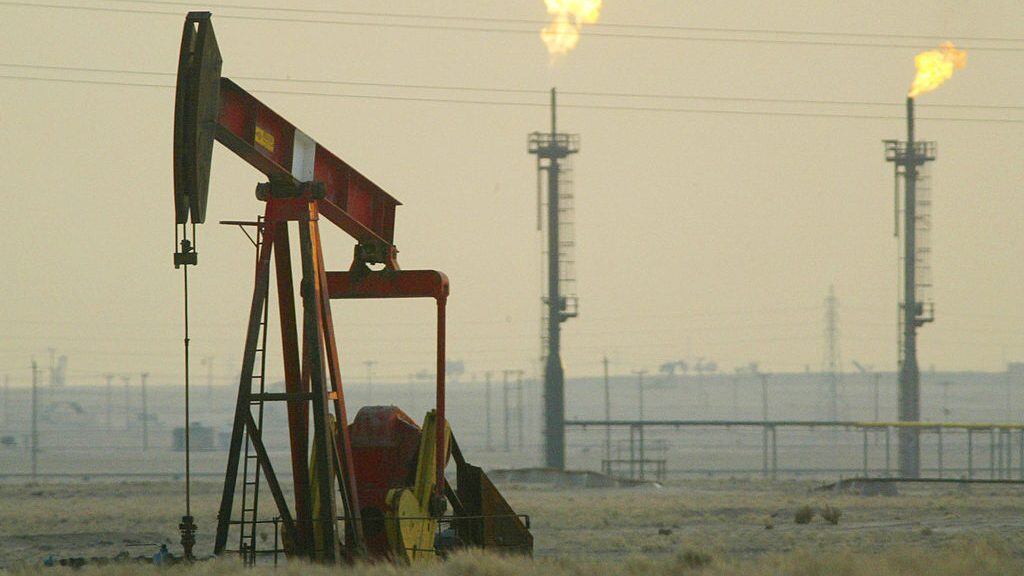 KUWAIT - JANUARY 15: A derek pumps in a oil field January 15, 2003 near the Saudi Arabian border, Kuwait. Kuwait produces 10% of the worlds oil and has promised to increase production as needed in the event of a war in Iraq. (Photo by Joe Raedle/Getty Images)
