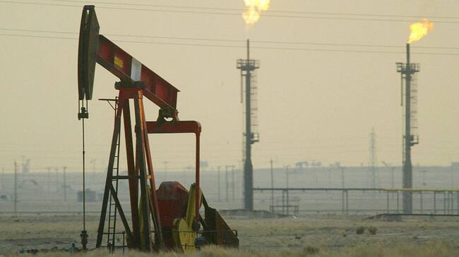 KUWAIT - JANUARY 15: A derek pumps in a oil field January 15, 2003 near the Saudi Arabian border, Kuwait. Kuwait produces 10% of the worlds oil and has promised to increase production as needed in the event of a war in Iraq. (Photo by Joe Raedle/Getty Images)