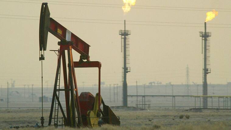 KUWAIT - JANUARY 15: A derek pumps in a oil field January 15, 2003 near the Saudi Arabian border, Kuwait. Kuwait produces 10% of the worlds oil and has promised to increase production as needed in the event of a war in Iraq. (Photo by Joe Raedle/Getty Images)