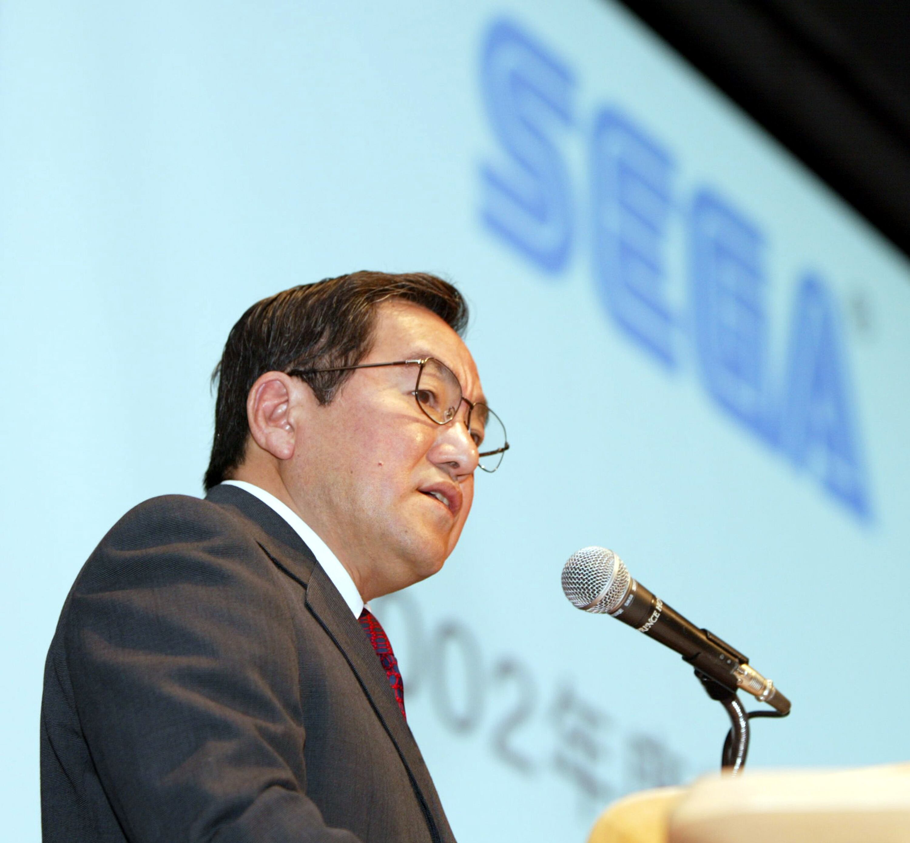 Sega Corp. Chief Executive Hideki Sato speaks during a press conference May 17, 2002. (Photo by Koichi Kamoshida/Getty Images)