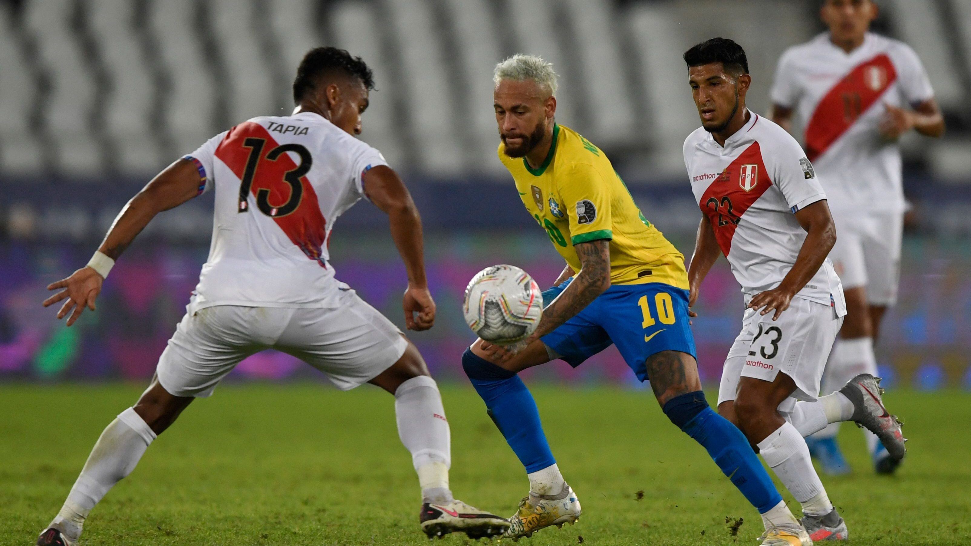 Peru's Renato Tapia (L) and Brazil's Neymar vie for the ball during their Conmebol Copa America 2021 football tournament group phase match at the Nilton Santos Stadium in Rio de Janeiro, Brazil, on June 17, 2021. (Photo by MAURO PIMENTEL / AFP) (Photo by MAURO PIMENTEL/AFP via Getty Images)