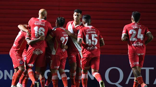 Argentina's Argentinos Juniors players celebrate a goal against Uruguay's Nacional during the Copa Libertadores football tournament group stage match at the Diego Armando Maradona stadium in Buenos Aires, on April 20, 2021. (Photo by RONALDO SCHEMIDT / AFP) (Photo by RONALDO SCHEMIDT/AFP via Getty Images)