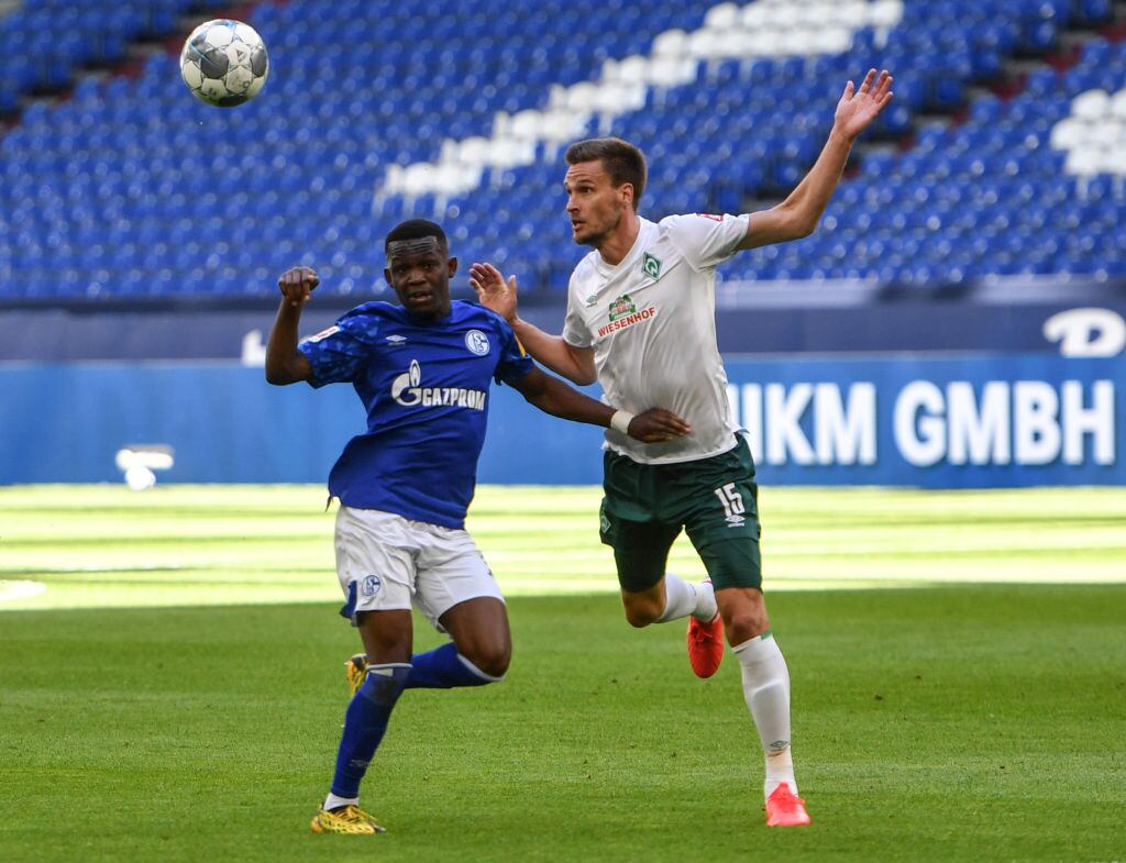 GELSENKIRCHEN, GERMANY - MAY 30: Rabbi Matondo of Schalke in action against Sebastian Langkamp of Bremen during the Bundesliga match between FC Schalke 04 and SV Werder Bremen at Veltins-Arena on May 30, 2020 in Gelsenkirchen, Germany. (Photo by Bernd Thissen/Pool via Getty Images)