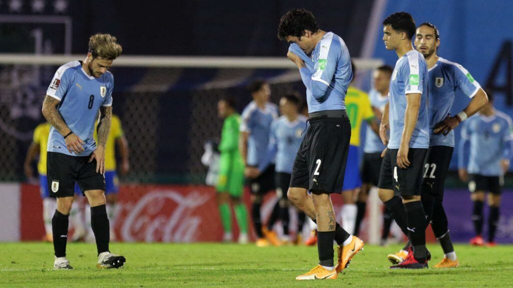 MONTEVIDEO, URUGUAY - NOVEMBER 17: Jose Maria Gimenez, Nahitan Nandez Agustin Oliveros and Martin Caceres of Uruguay lament after a match between Uruguay and Brazil as part of South American Qualifiers for World Cup FIFA Qatar 2022 at Centenario Stadium on November 17, 2020 in Montevideo, Uruguay. (Photo by Matilde Campodonico - Pool/Getty Images)