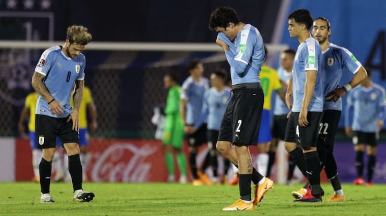 MONTEVIDEO, URUGUAY - NOVEMBER 17: Jose Maria Gimenez, Nahitan Nandez Agustin Oliveros and Martin Caceres of Uruguay lament after a match between Uruguay and Brazil as part of South American Qualifiers for World Cup FIFA Qatar 2022 at Centenario Stadium on November 17, 2020 in Montevideo, Uruguay. (Photo by Matilde Campodonico - Pool/Getty Images)