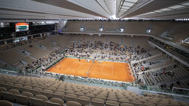 PARIS, FRANCE October 11. A general view of Rafael Nadal of Spain in action against Novak Djokovic of Serbia in the Men's Singles Final on Court Philippe-Chatrier with the roof closed during the French Open Tennis Tournament at Roland Garros on October 11th 2020 in Paris, France. (Photo by Tim Clayton/Corbis via Getty Images)