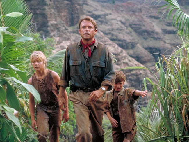 Actor Sam Neill as Dr. Alan Grant, with Ariana Richards (left) and Joseph Mazzello (right) as Lex and Tim, in a scene from the film 'Jurassic Park', 1993. (Photo by Murray Close/Getty Images)