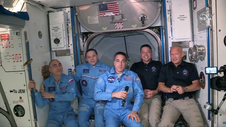INTERNATIONAL SPACE STATION - MAY 31: In this screen grab from NASA's feed, NASA astronauts Doug Hurley (R) and Bob Behnken (2R) join NASA astronaut Chris Cassidy (C) and Russian cosmonauts, Anatoly Ivanishin (L) and Ivan Vagner (2L) aboard the International Space Station after successfully docking SpaceX's Dragon capsule May 31, 2020. The docking occurred just 19 hours after a SpaceX Falcon 9 rocket blasted off Saturday afternoon from Kennedy Space Center, the nation’s first astronaut launch to orbit from home soil in nearly a decade. (Photo by NASA via Getty Images)