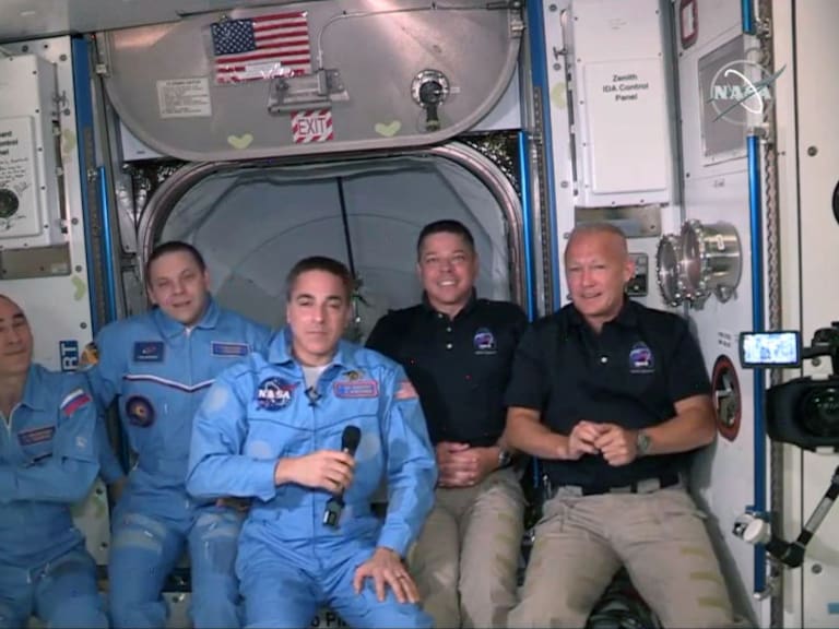 INTERNATIONAL SPACE STATION - MAY 31: In this screen grab from NASA&#039;s feed, NASA astronauts Doug Hurley (R) and Bob Behnken (2R) join NASA astronaut Chris Cassidy (C) and Russian cosmonauts, Anatoly Ivanishin (L) and Ivan Vagner (2L) aboard the International Space Station after successfully docking SpaceX&#039;s Dragon capsule May 31, 2020. The docking occurred just 19 hours after a SpaceX Falcon 9 rocket blasted off Saturday afternoon from Kennedy Space Center, the nation’s first astronaut launch to orbit from home soil in nearly a decade. (Photo by NASA via Getty Images)