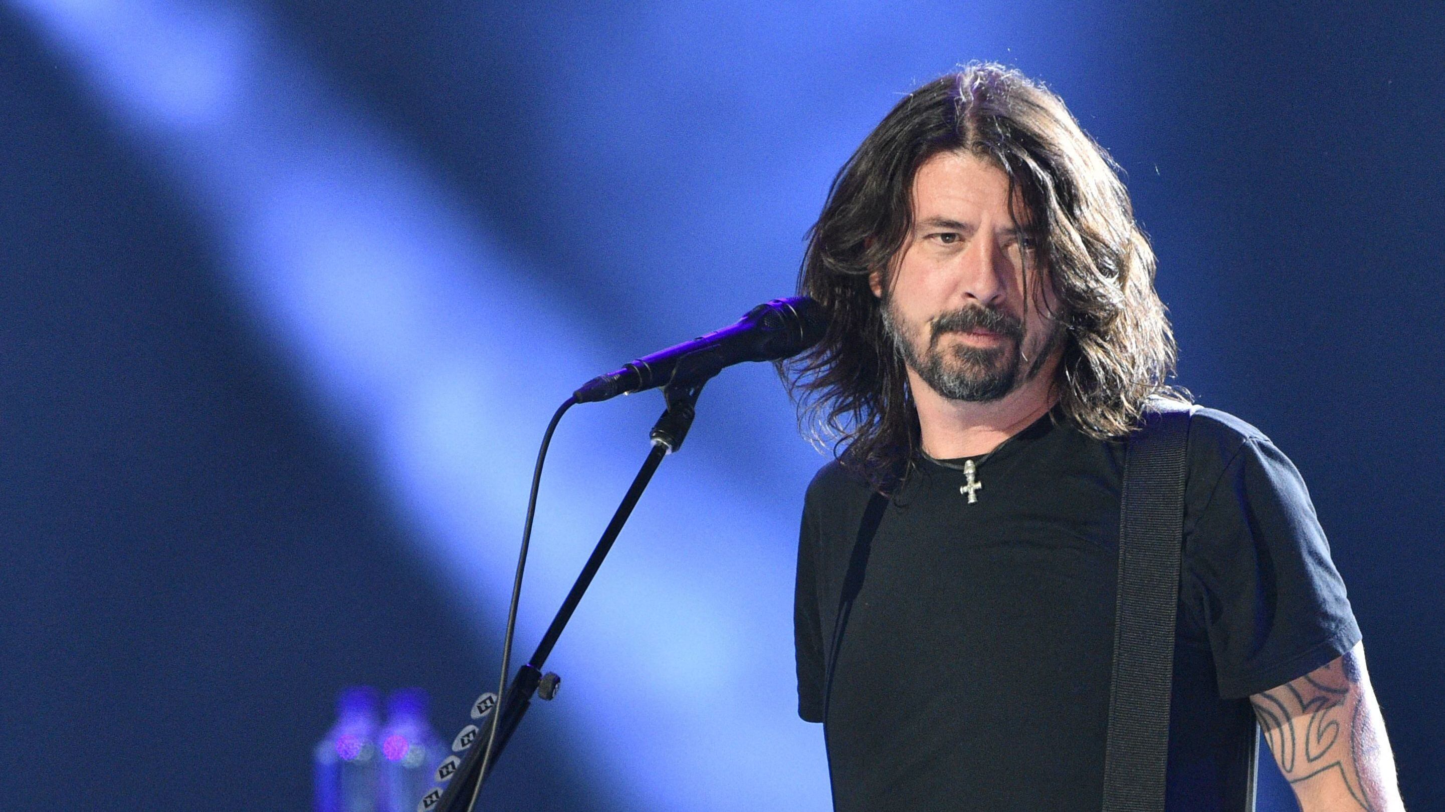 Dave Grohl of the Foo Fighters performs onstage during the taping of the "Vax Live" fundraising concert at SoFi Stadium in Inglewood, California, on May 2, 2021. - The fundraising concert "Vax Live: The Concert To Reunite The World", put on by international advocacy organization Global Citizen, is pushing businesses to "donate dollars for doses," and for G7 governments to share excess vaccines. The concert will be pre-taped on May 2 in Los Angeles, and will stream on YouTube along with American television networks ABC and CBS on May 8. (Photo by VALERIE MACON / AFP) (Photo by VALERIE MACON/AFP via Getty Images)