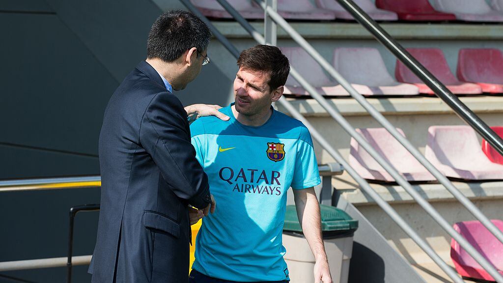 BARCELONA, SPAIN - APRIL 14:  President of FC Barcelona Josep Maria Bartomeu (L) greets Lionel Messi during the training session at Ciutat Esportiva on April 14, 2014 in Barcelona, Spain.  (Photo by Miguel Ruiz/FC Barcelona via Getty Images)
