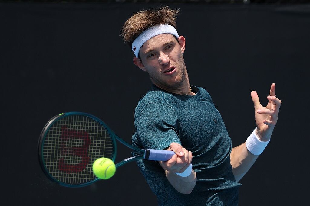 MELBOURNE, AUSTRALIA - JANUARY 15: Nicolas Jarry of Chile plays a forehand in their round one singles match against Flavio Cobolli of Italy during the 2024 Australian Open at Melbourne Park on January 15, 2024 in Melbourne, Australia. (Photo by Daniel Pockett/Getty Images)