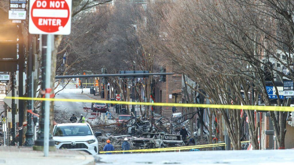 NASHVILLE, TENNESSEE - DECEMBER 25: Police close off an area damaged by an explosion on Christmas morning on December 25, 2020 in Nashville, Tennessee. A Hazardous Devices Unit was en route to check on a recreational vehicle which then exploded, extensively damaging some nearby buildings. According to reports, the police believe the explosion to be intentional, with at least 3 injured and human remains found in the vicinity of the explosion. (Photo by Terry Wyatt/Getty Images)