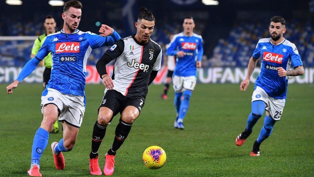 Juventus' Portuguese forward Cristiano Ronaldo (2ndL) outruns Napoli's Spanish defender Fabian Ruiz (L) during the Italian Serie A football match Napoli vs Juventus on January 26, 2020 at the San Paolo stadium in Naples. (Photo by Alberto PIZZOLI / AFP) (Photo by ALBERTO PIZZOLI/AFP via Getty Images)