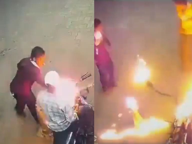 Hombre enciende dispensador de bencina tras prender un cigarro en India.