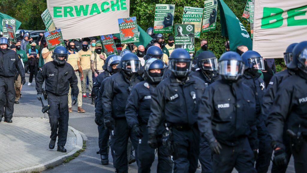 BERLIN, GERMANY - OCTOBER 03: Supporters of the far-right Third Way (Der Dritte Weg) neo-Nazi political party march on the 30th anniversary of German reunification in Hohenschoenhausen district on October 3, 2020 in Berlin, Germany. Several radical groups, including the Third Way as well as coronavirus skeptics preaching the overthrow of the German government, are taking to the streets today in Berlin. The Third Way has been active since 2013 and is an offshoot of the mostly defunct far-right NPD (National Democratic Party of Germany). (Photo by Omer Messinger/Getty Images)