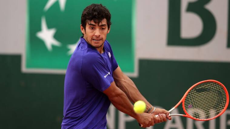PARIS, FRANCE - JUNE 02: Cristian Garin of Chile plays a backhand during his mens second round match against Mackenzie McDonald of the United States during day four of the 2021 French Open at Roland Garros on June 02, 2021 in Paris, France. (Photo by Adam Pretty/Getty Images)