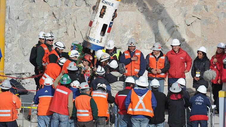 Chilean miner Alex Vega gives the thumbs up upon exiting the Fenix capsule after being brought to the surface in the ninth place, on October 13, 2010 following a 10-week ordeal in the collapsed San Jose mine, near Copiapo, 800 km north of Santiago, Chile. AFP PHOTO/ Rodrigo ARANGUA (Photo credit should read RODRIGO ARANGUA/AFP via Getty Images)