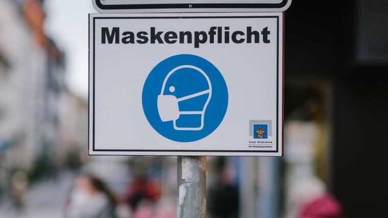 07 December 2020, Lower Saxony, Hildesheim: There's a sign downtown that says "masked duty." Photo: Ole Spata/dpa (Photo by Ole Spata/picture alliance via Getty Images)