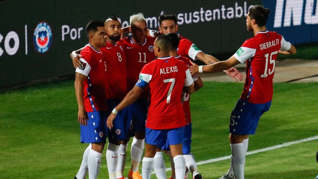 Chile's players celebrate after scoring against Colombia during their 2022 FIFA World Cup South American qualifier football match at the National Stadium in Santiago, on October 13, 2020, amid the COVID-19 novel coronavirus pandemic. (Photo by Alberto Valdes / POOL / AFP) (Photo by ALBERTO VALDES/POOL/AFP via Getty Images)
