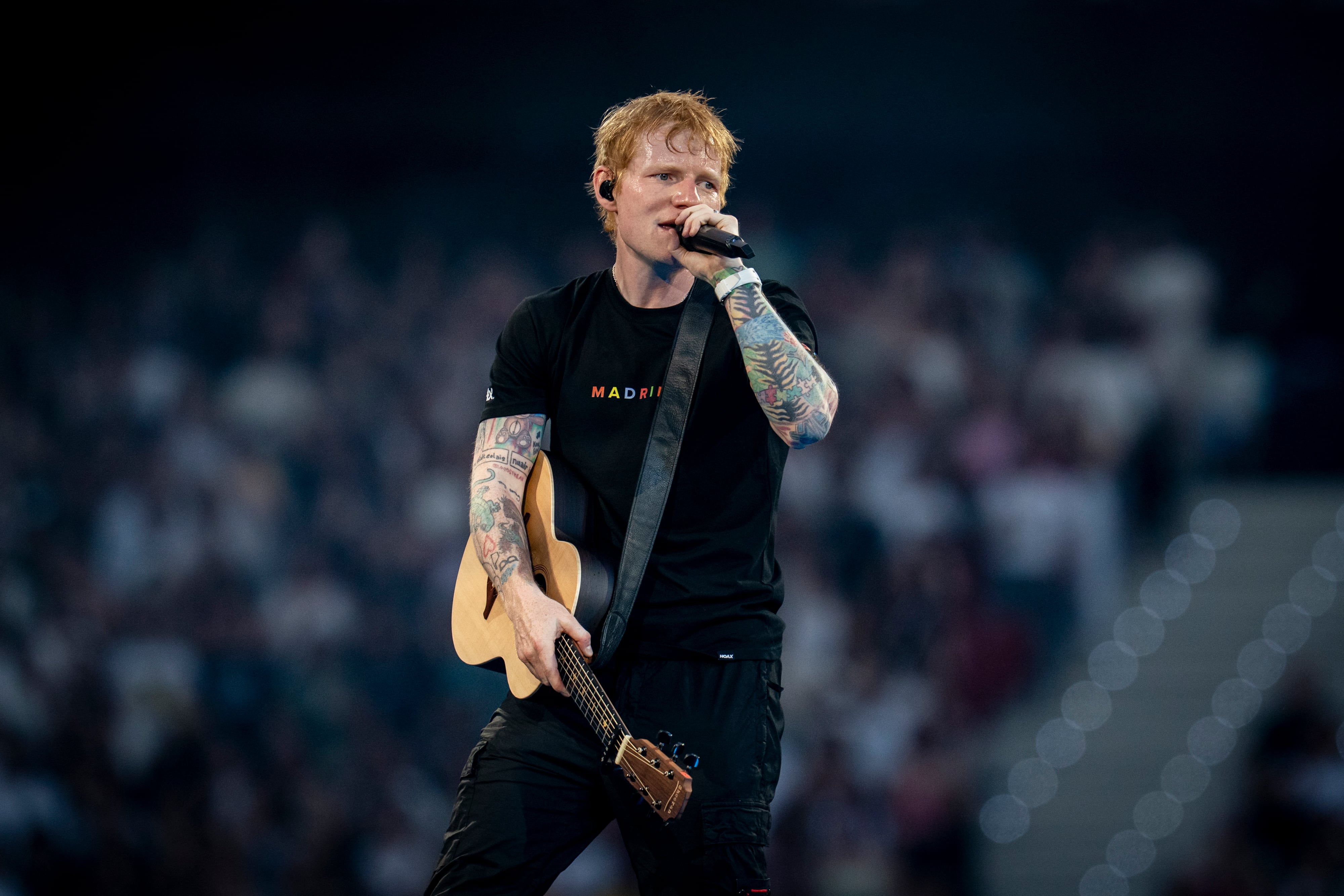 MADRID, SPAIN - MAY 30: Singer Ed Sheeran during his concert at the Riyadh Air Metropolitano on May 30, 2025, in Madrid, Spain. Ed Sheeran has sold out his two concerts in Madrid, today, May 30, and tomorrow, May 31, bringing together 140,000 people and breaking records at the Metropolitano Stadium. These shows inaugurate his Mathematics Tour 2025, which will tour 13 European countries this summer. In Madrid, he will review his greatest hits and has performed live tracks from his upcoming album 'Play', which will be released in September. After successful tours in the United States, Asia and the Middle East, he is embarking on a new musical stage. (Photo By A. Perez Meca/Europa Press via Getty Images)