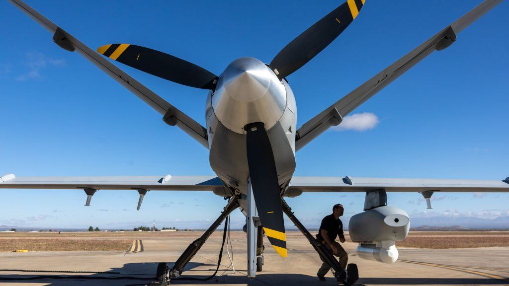 FORT HUACHUCA, ARIZONA - NOVEMBER 04: A drone pilot with Customs and Border Protection (CBP) performs a pre-flight check on an MQ-9 Reaper camera system before flying a mission over the U.S.-Mexico border on November 04, 2022 at Fort Huachuca, Arizona. CBP air interdiction agents with U.S. Air and Marine Operations (AMO) pilot the surveillance drones from the base to detect immigrants crossing illegally from Mexico into remote and rugged areas of southeastern Arizona. The drone operators pass on the information to ground agents pursuing migrants heading north. (Photo by John Moore/Getty Images)