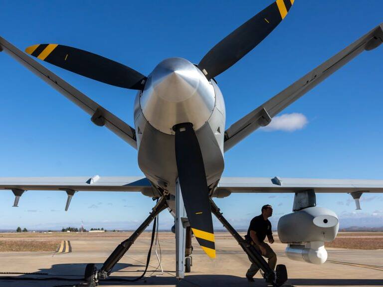 FORT HUACHUCA, ARIZONA - NOVEMBER 04: A drone pilot with Customs and Border Protection (CBP) performs a pre-flight check on an MQ-9 Reaper camera system before flying a mission over the U.S.-Mexico border on November 04, 2022 at Fort Huachuca, Arizona. CBP air interdiction agents with U.S. Air and Marine Operations (AMO) pilot the surveillance drones from the base to detect immigrants crossing illegally from Mexico into remote and rugged areas of southeastern Arizona. The drone operators pass on the information to ground agents pursuing migrants heading north. (Photo by John Moore/Getty Images)