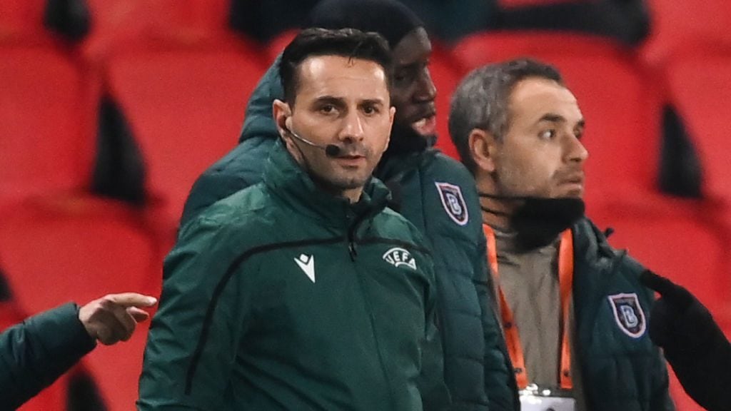 Romanian 4th referee Sebastian Coltescu looks on during the UEFA Champions League group H football match between Paris Saint-Germain (PSG) and Istanbul Basaksehir FK at the Parc des Princes stadium in Paris, on December 8, 2020. - Paris Saint-Germain's decisive Champions League game with Istanbul Basaksehir was suspended today in the first half as the players walked off amid allegations of racism by one of the match officials.The row erupted after Basaksehir assistant coach Pierre Webo, the former Cameroon international, was shown a red card during a fierce row on the touchline with staff from the Turkish club appearing to accuse the Romanian fourth official of using a racist term. (Photo by FRANCK FIFE / AFP) (Photo by FRANCK FIFE/AFP via Getty Images)