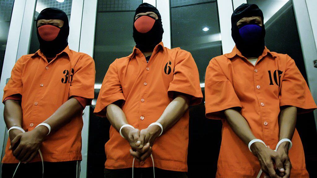 Three suspects are displayed at the national police headquarters in Jakarta on September 2, 2016, accused of being in connection with an online paedophile ring.Indonesian police said on September 1 they have arrested three suspects in connection with an online paedophile ring that allegedly linked adult men to about 100 mostly teenage boys. / AFP / AZQA HARUN (Photo credit should read AZQA HARUN/AFP via Getty Images)