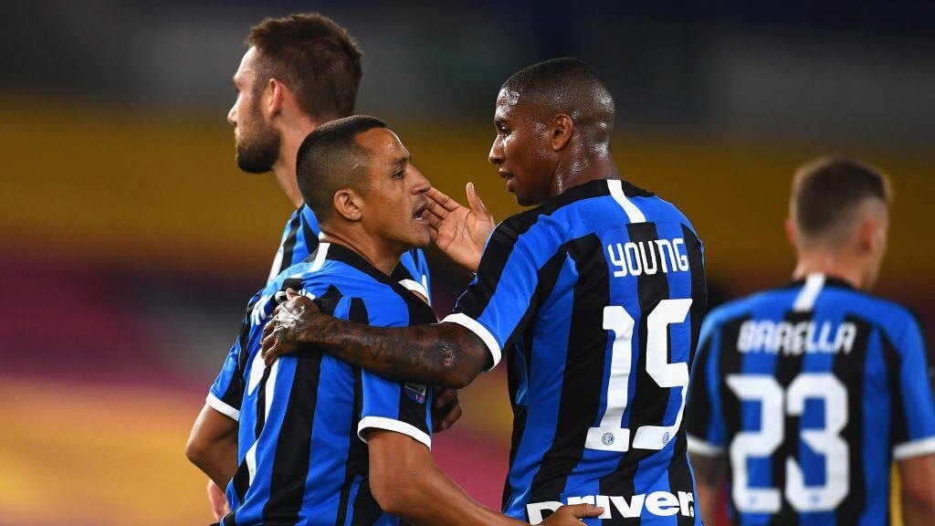 ROME, ITALY - JULY 19: Alexis Sanchez (L) and Ashley Young of FC Internazionale celebrate after Stefan De Vrji scored the opening goal during the Serie A match between AS Roma and FC Internazionale at Stadio Olimpico on July 19, 2020 in Rome, Italy. (Photo by Claudio Villa - Inter/Inter via Getty Images)