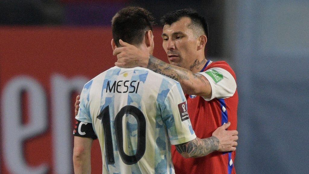 Argentina's Lionel Messi (L) and Chile's Gary Medel greet each other after tying 1-1 in their South American qualification football match for the FIFA World Cup Qatar 2022 at the Estadio Unico Madre de Ciudades stadium in Santiago del Estero, Argentina, on June 3, 2021. (Photo by Juan MABROMATA / POOL / AFP) (Photo by JUAN MABROMATA/POOL/AFP via Getty Images)