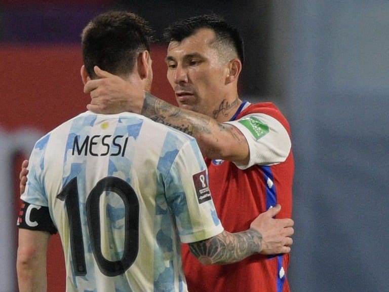 Argentina's Lionel Messi (L) and Chile's Gary Medel greet each other after tying 1-1 in their South American qualification football match for the FIFA World Cup Qatar 2022 at the Estadio Unico Madre de Ciudades stadium in Santiago del Estero, Argentina, on June 3, 2021. (Photo by Juan MABROMATA / POOL / AFP) (Photo by JUAN MABROMATA/POOL/AFP via Getty Images)