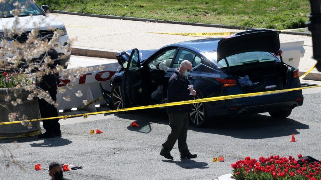 WASHINGTON, DC - APRIL 02: Law enforcement investigate the scene after a vehicle charged a barricade at the U.S. Capitol on April 02, 2021 in Washington, DC. The U.S. Capitol was briefly locked down after a person reportedly rammed a vehicle into multiple Capitol Hill police officers. One officer was killed and one was wounded. The suspect who exited the vehicle with a knife was shot and later died. (Photo by Win McNamee/Getty Images)
